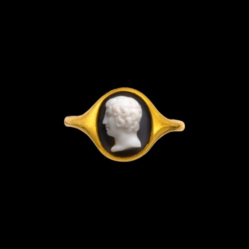 A high carat gold ring set with a Neoclassical onyx cameo. Portrait of a Youth.